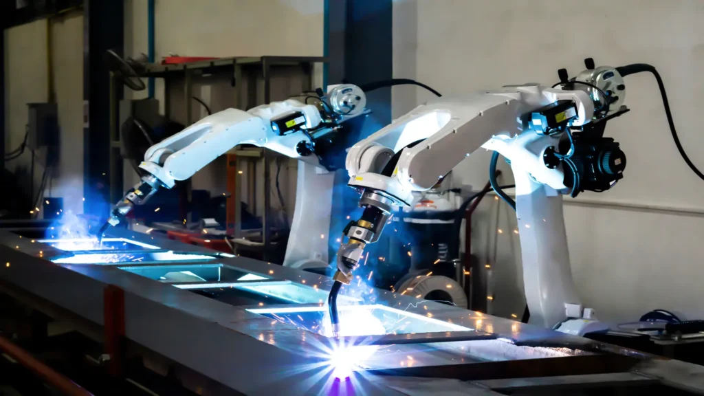 Concept of two automatic welding robots working in the factory.