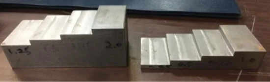 Figura 2: Bloques escalonados de acero, de White [1]