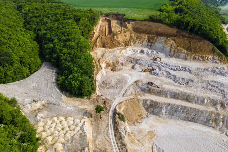 Open pit mining of construction sand stone materials with excava