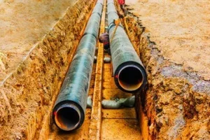 Inspection and protection of coatings on buried pipelines