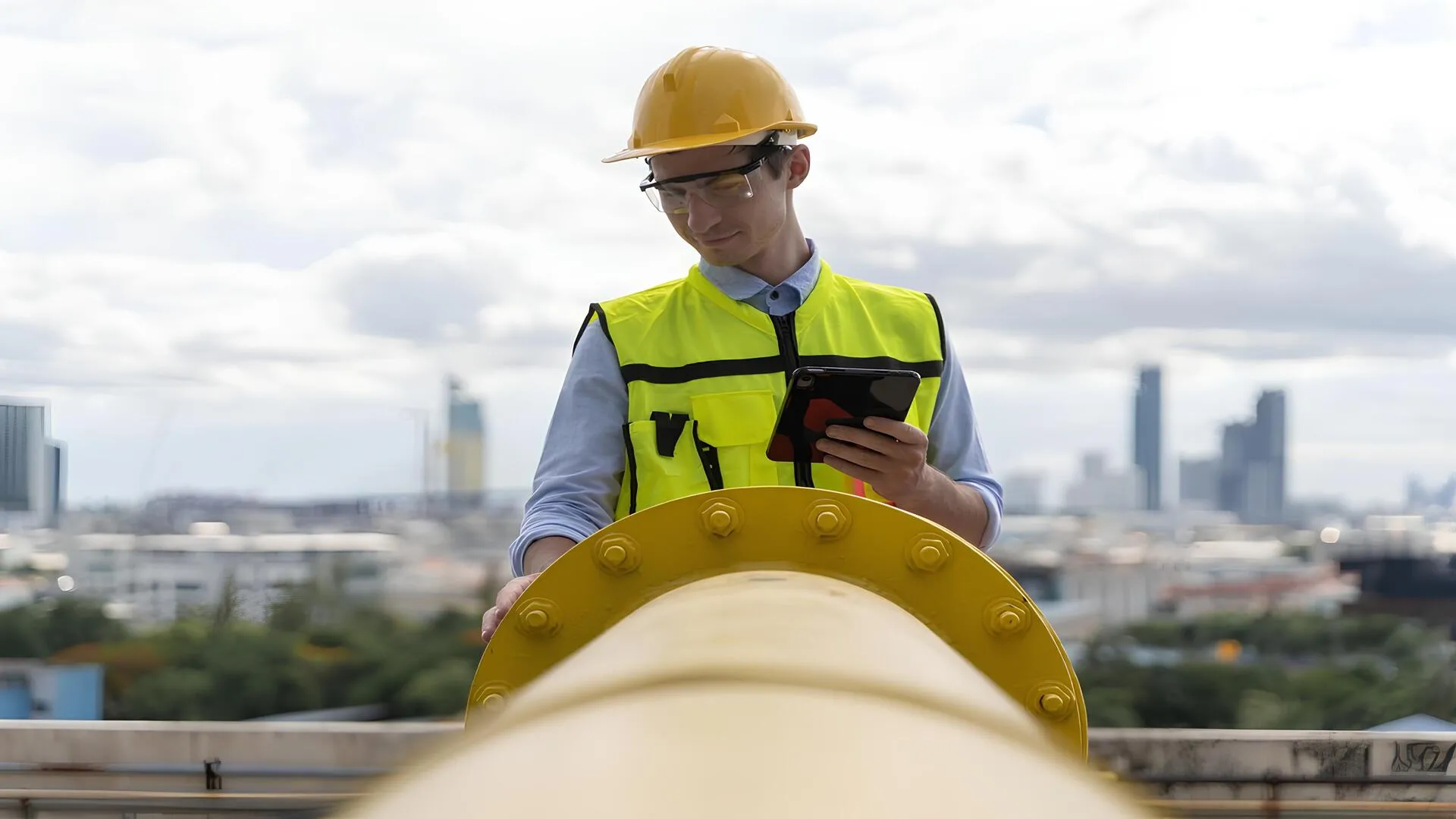 Bolted flange joint certification shown through an inspector verifying a pipeline flange connection.