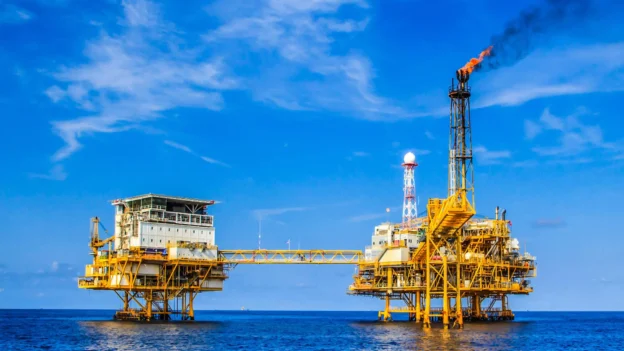 Connected offshore platforms operating at sea with metal structures exposed to corrosion.