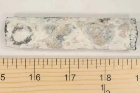 Corroded zinc ribbon from corrosive soil