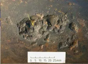 Crater Like pits below corrosion