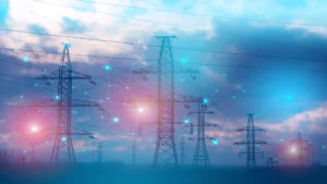 Power transmission towers connected by a digital network representing the use of artificial intelligence in the energy sector