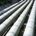 Metallic pipelines used in AMPP-led projects for CO₂ transport and injection in CCUS systems