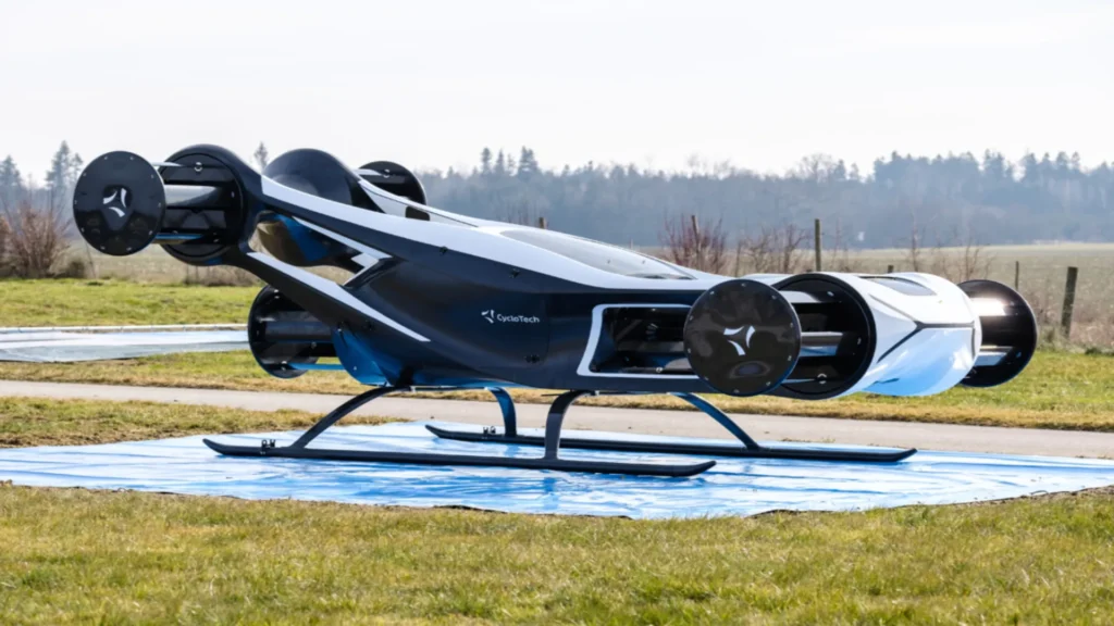 Vehículo volador experimental tipo eVTOL modelo BlackFly de CycloTech, equipado con rotores cilíndricos horizontales y estacionado sobre césped.