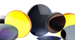 Optical lenses and infrared windows made of zinc selenide (yellow) and germanium (dark) for thermal camera housings.